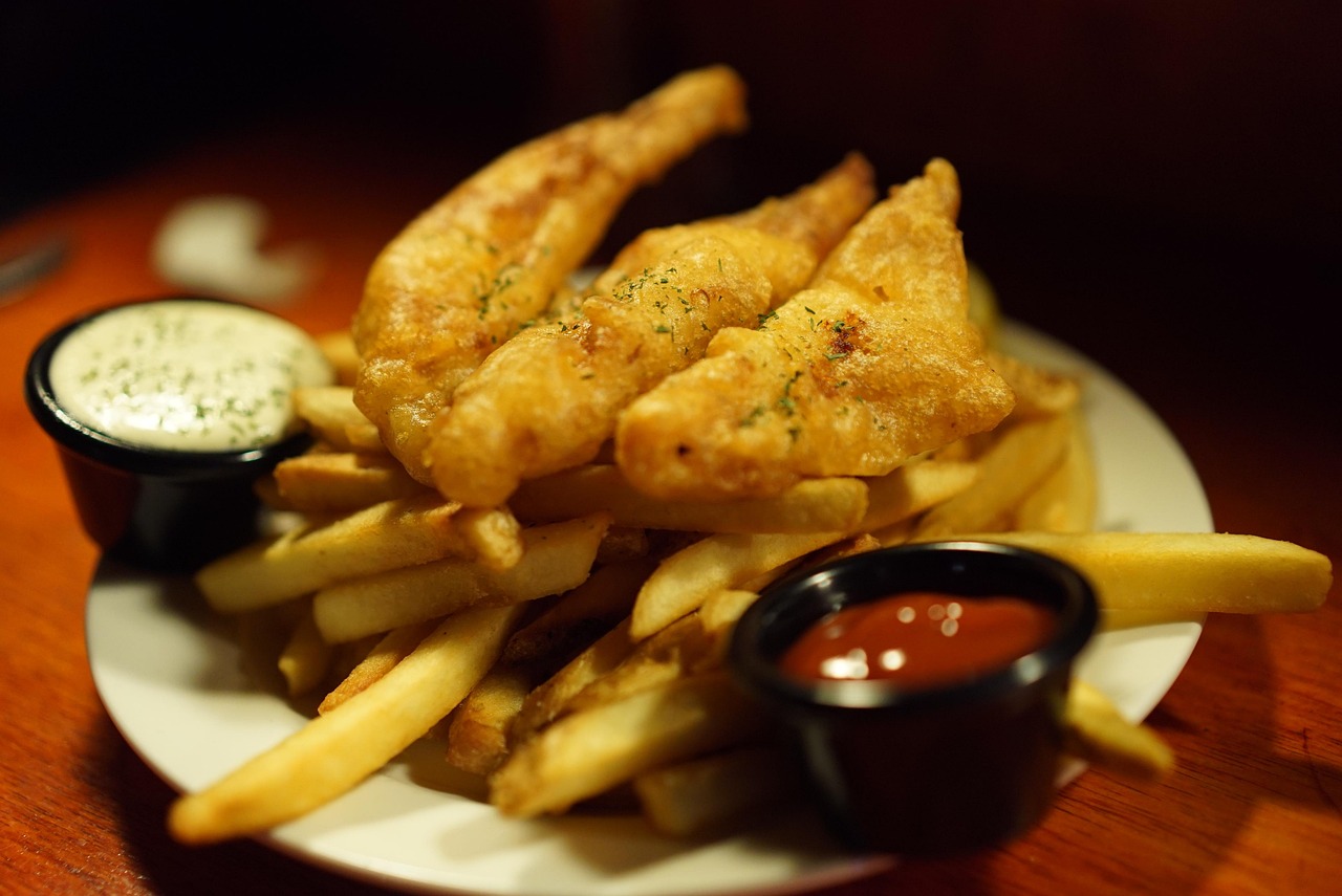 Traditional British fish and chips with mushy peas and tartar sauce